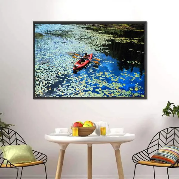 Canoeing In Water Lilies Canvas Wall Art